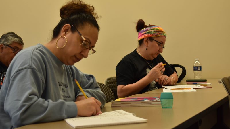 Two ESL students at a desk