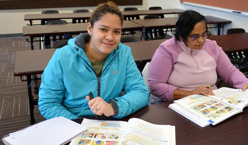 Two ESL students at a desk