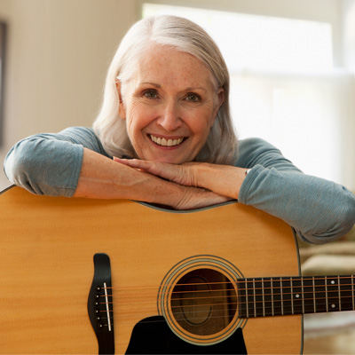 Person with an acoustic guitar